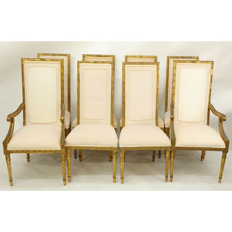 Set of Eight (8) Italian Neoclassical Style Gilt Carved and Upholstered Chairs. Includes two arm chairs and six side chairs.