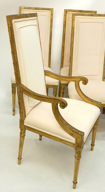 Set of Eight (8) Italian Neoclassical Style Gilt Carved and Upholstered Chairs. Includes two arm chairs and six side chairs.