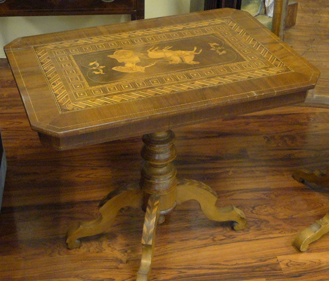 Lot of Two (2) Associated 19th Century Italian Inlaid Walnut Tilt-top Game Tables or Side Tables each with Marquetry Inlay of a Roman Charioteer and a Double Parquetry Border Comprised of Various Exotic Woods.