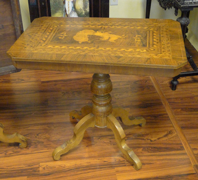 Lot of Two (2) Associated 19th Century Italian Inlaid Walnut Tilt-top Game Tables or Side Tables each with Marquetry Inlay of a Roman Charioteer and a Double Parquetry Border Comprised of Various Exotic Woods.