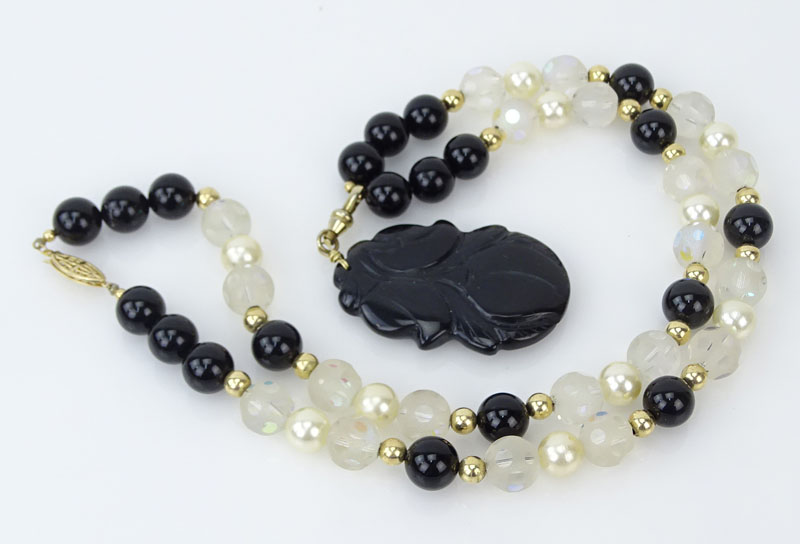 Black Onyx, Carved Crystal, Pearl and 14 Karat Yellow Gold Pendant Necklace. 
