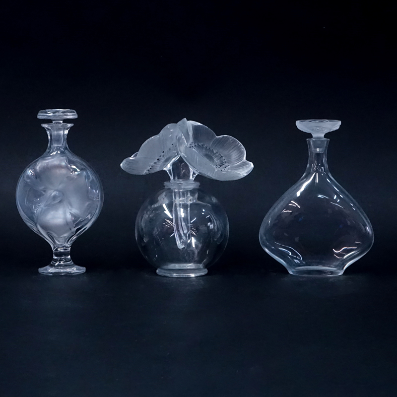 Grouping of Three (3) Lalique Crystal Perfume Bottles.