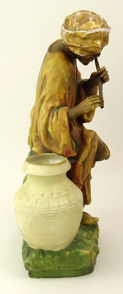 Early 20th Century Austrian Amphora Porcelain Figure, Arab Man Playing Flute.