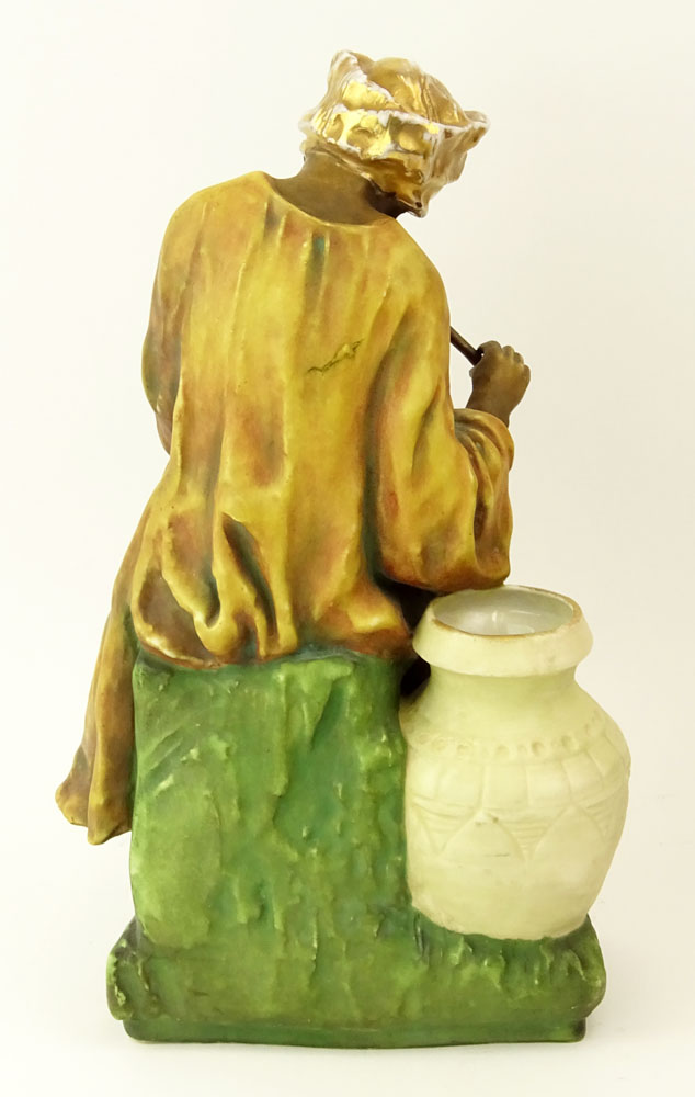 Early 20th Century Austrian Amphora Porcelain Figure, Arab Man Playing Flute.