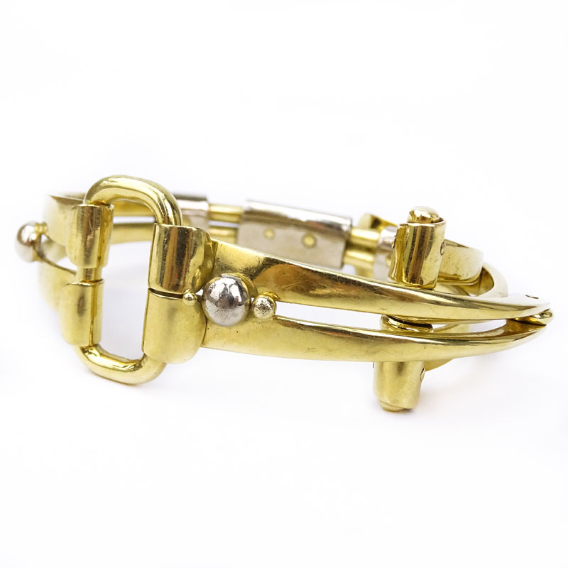 Amitai Kav, Israeli Circa 1995 Heavy 18 Karat Yellow and White Gold Modern Design Folding Horse Bit style Bracelet.