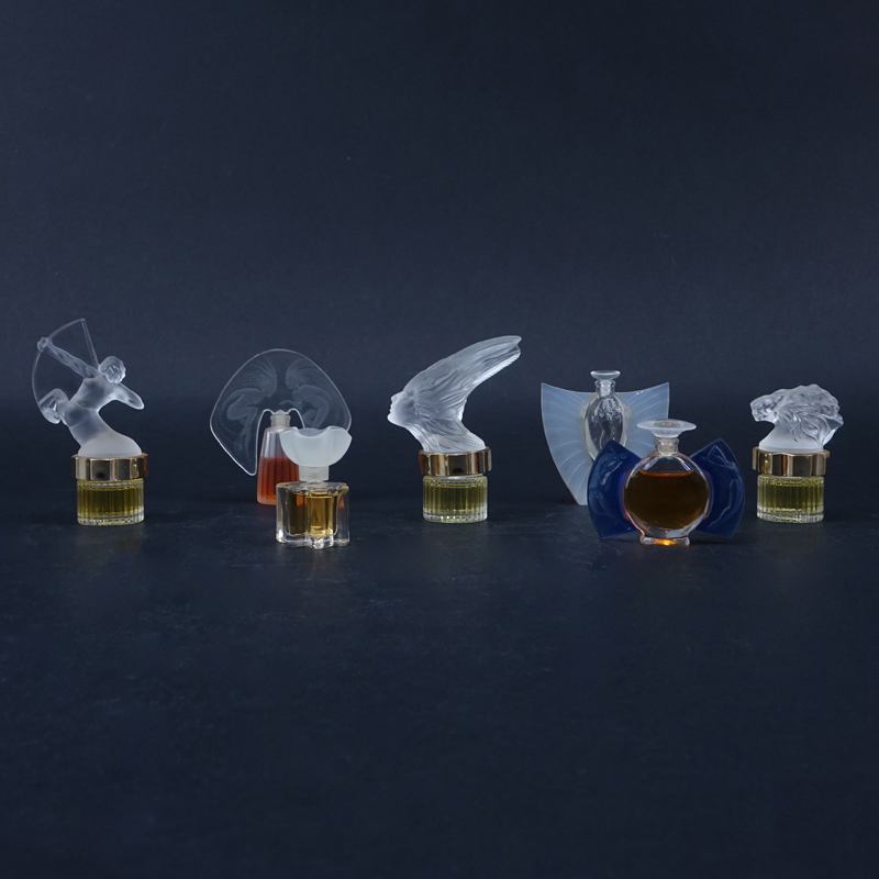 Seven (7) Miniature Lalique Bottles.