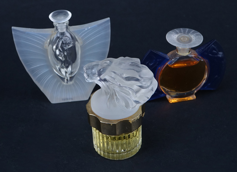 Seven (7) Miniature Lalique Bottles.