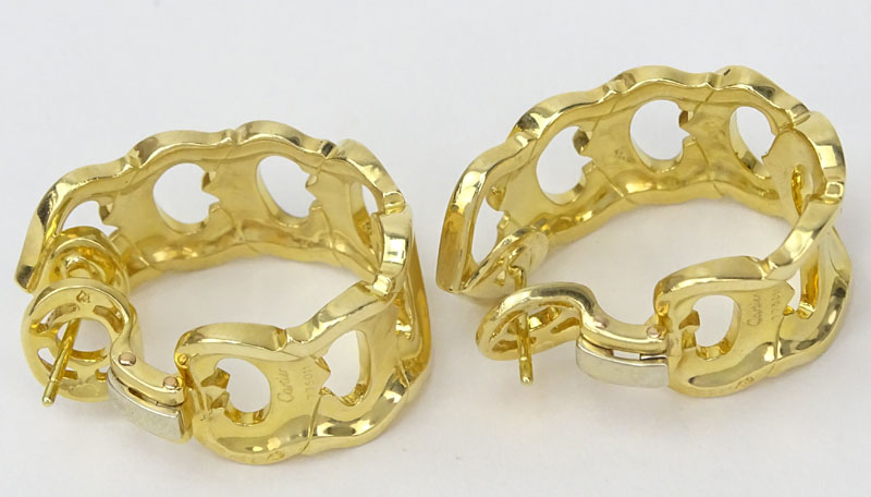 Cartier C de Cartier 18 Karat Yellow Gold Oval Semi Hoop Earrings Omega Back.