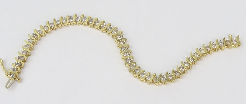 Vintage Approx. 4.30 Carat Round Brilliant Cut Diamond and 14 Karat Yellow Gold Tennis Bracelet.