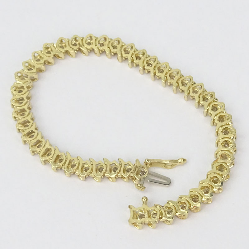 Vintage Approx. 4.30 Carat Round Brilliant Cut Diamond and 14 Karat Yellow Gold Tennis Bracelet.