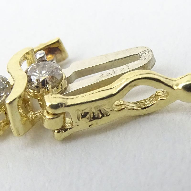 Vintage Approx. 4.30 Carat Round Brilliant Cut Diamond and 14 Karat Yellow Gold Tennis Bracelet.