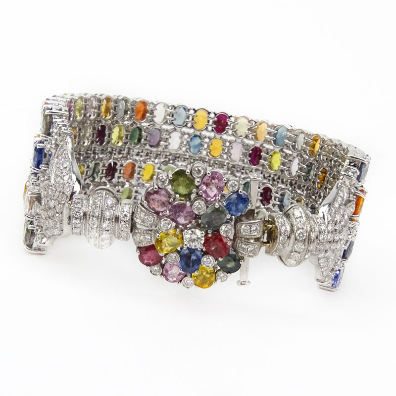 Approx. 75.48 Carat Oval Cut Multi Color Sapphire, 4.85 Carat Round Brilliant Cut Diamond and 18 Karat White Gold Wide Bracelet. 