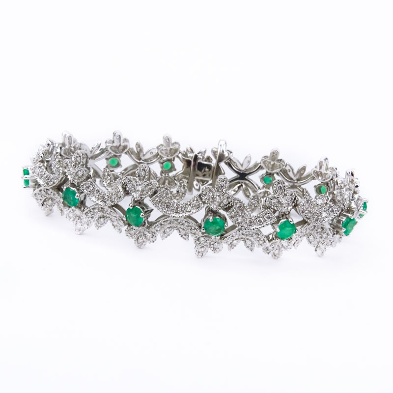 Approx. 2.33 Carat Pave Set Round Brilliant Cut Diamond, 2.20 Carat Round Brilliant Cut Emerald and 18 Karat White Gold Bracelet. 