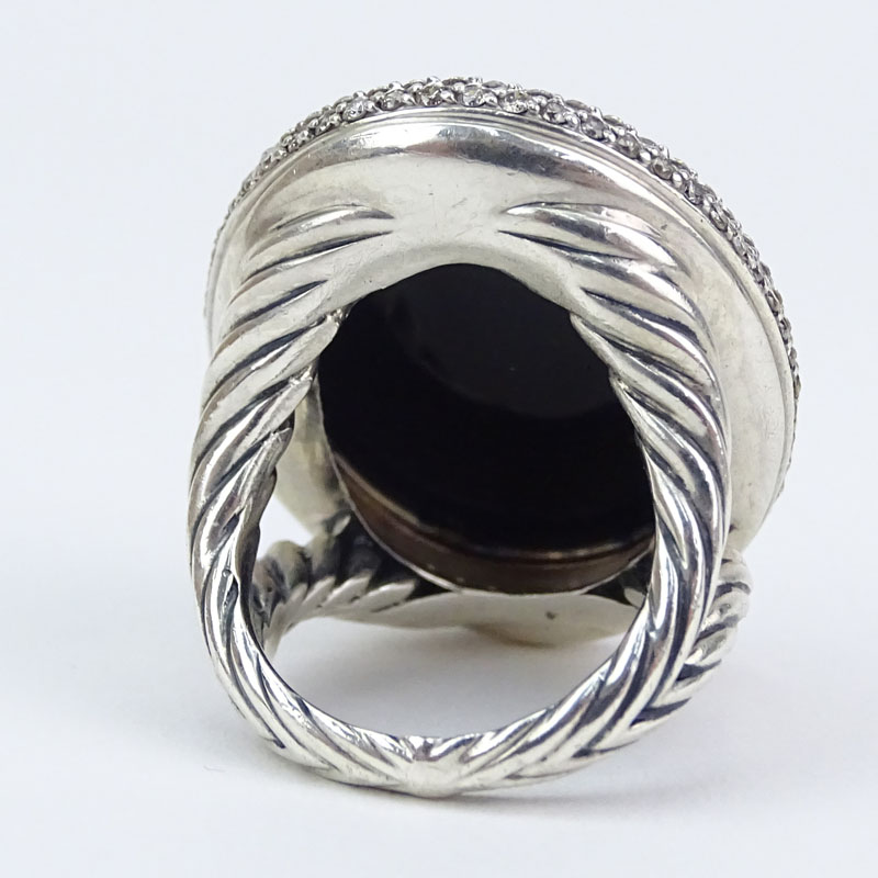 David Yurman Approx. .46 Carat Round Brilliant Cut Diamond, Oval Cut Black Onyx and Sterling Silver Ring. 