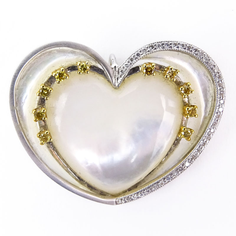 Approx. .47 Carat Round Brilliant Cut Diamond, .28 Carat Round Brilliant Cut Yellow Diamond, Mother of Pearl and 18 Karat White Gold Pendant.