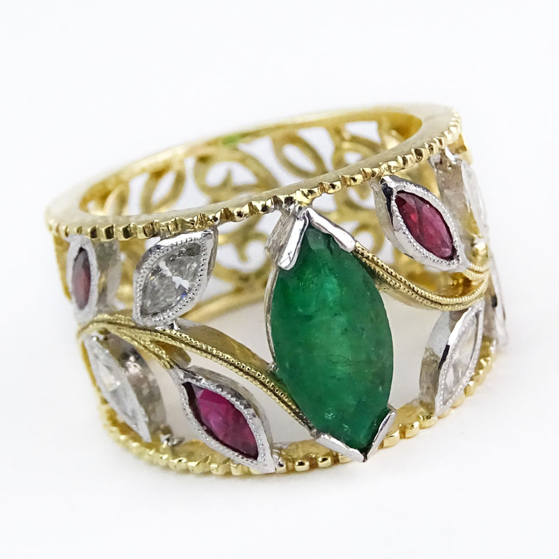 Approx. 1.54 Carat Emerald and Ruby, .52 Carat Diamond and 18 Karat Yellow and White Gold Ring. 