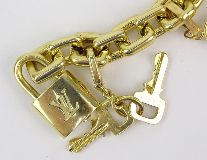 Louis Vuitton Heavy 18 Karat Yellow Gold and Pink Quartz Charm Bracelet with Four Charms.