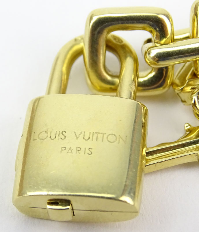 Louis Vuitton Heavy 18 Karat Yellow Gold and Pink Quartz Charm Bracelet with Four Charms.