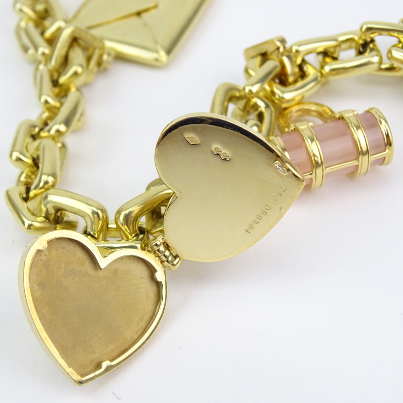 Louis Vuitton Heavy 18 Karat Yellow Gold and Pink Quartz Charm Bracelet with Four Charms.