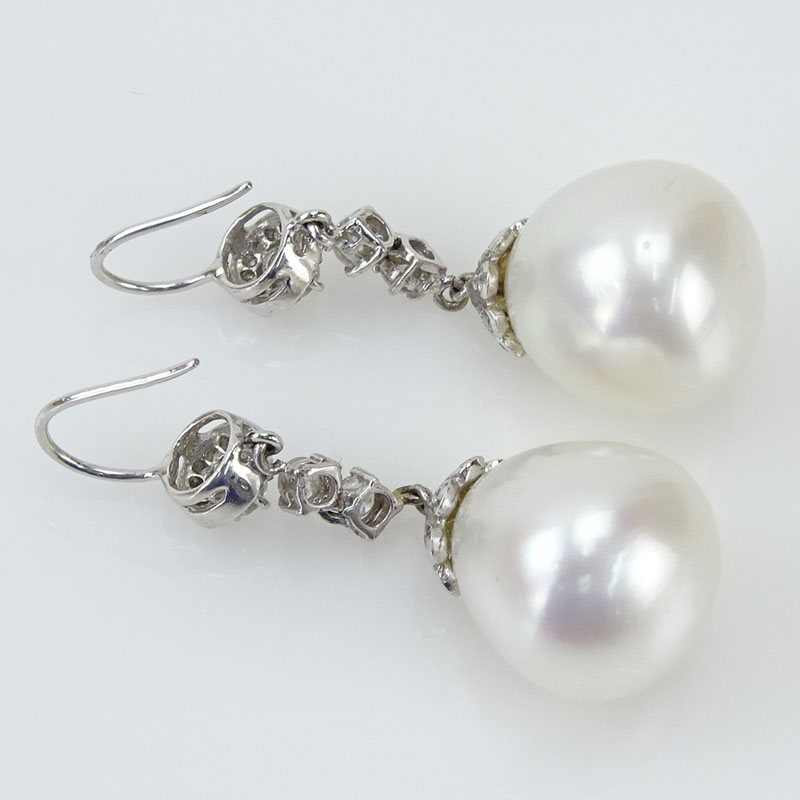 White Pearl, Approx. .91 Carat Round Brilliant Cut Diamond and 18 Karat White Gold Pendant Earrings. 
