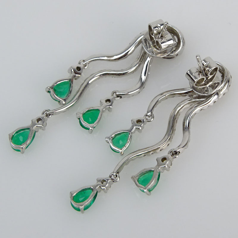 Approx. 1.80 Carat Pear Shape Emerald, 1.60 Carat Round Brilliant Cut Diamond and 18 Karat White Gold Earrings. 