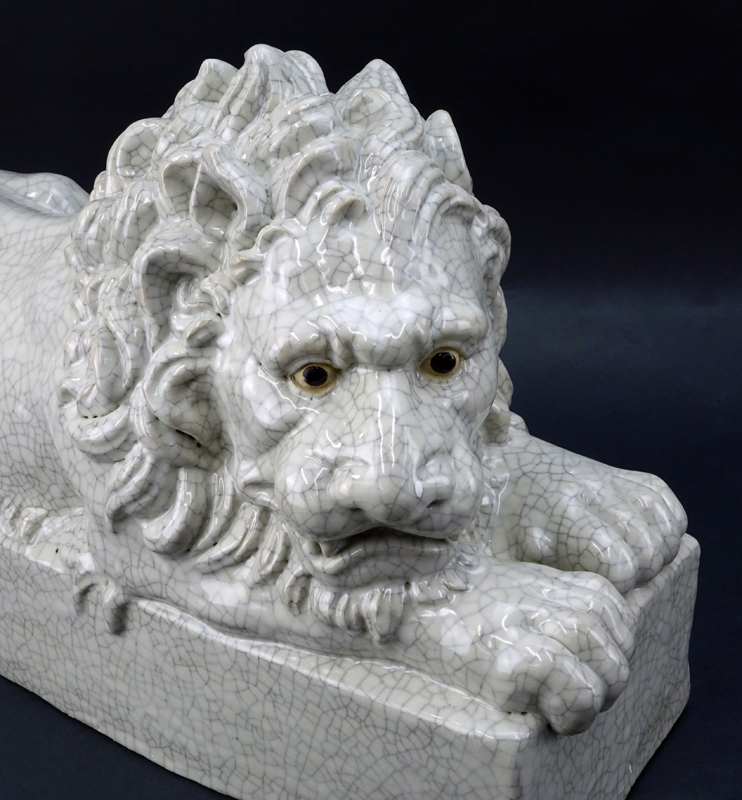 Pair of Large Glazed Pottery Resting Lions.