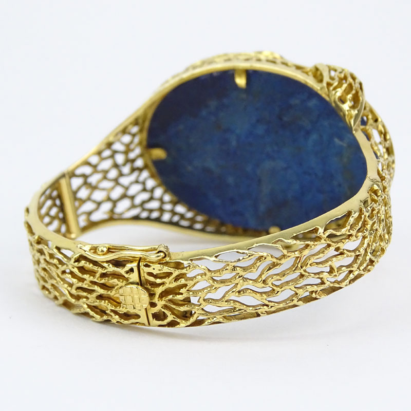Vintage Ilias Lalaounis 18 Karat Yellow Gold and Lapis Lazuli Snake Design Hinged Bangle Bracelet with Ruby Eye.