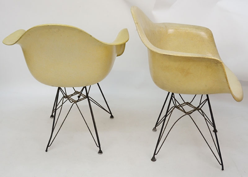 Pair of Eames for Herman Miller Molded Fiberglass Arm Chairs on Eiffel Tower Bases.