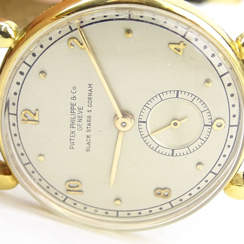 Vintage Patek Philippe for Black Starr & Gorham 18 Karat Yellow Gold Manual Movement Watch with Small Seconds Dial, Leather Strap and 18 Karat Yellow Gold Buckle. 