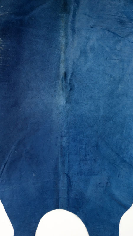 Modern Blue Cowhide Rug. Fading or wear to a section.