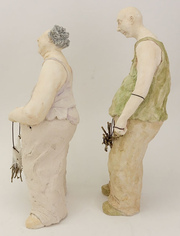 Two Contemporary Pottery Figures. Man And Woman With Sticks.