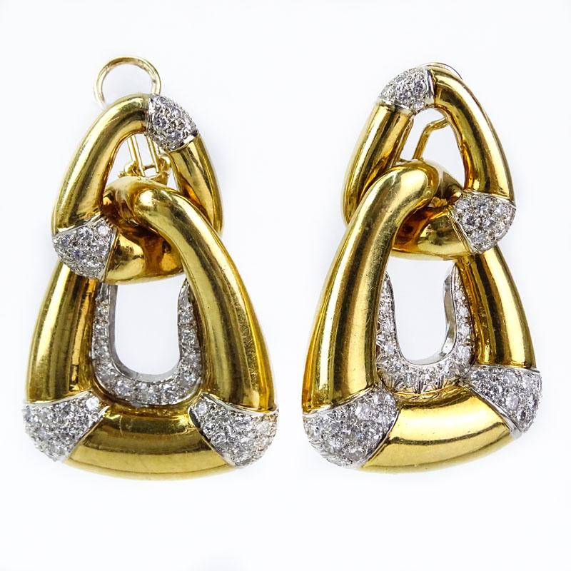 Vintage Approx. 5.0 Carat Round Brilliant Cut Diamond and Heavy 18 Karat Yellow and White Gold Earrings.