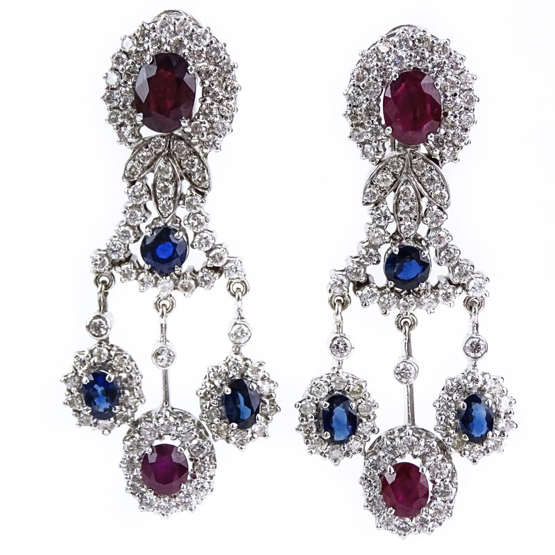Vintage Approx. 7.0 carat Round Brilliant Cut Diamond, Oval Cut Rubies and Sapphires and 14 Karat White Gold Chandelier Earrings. 