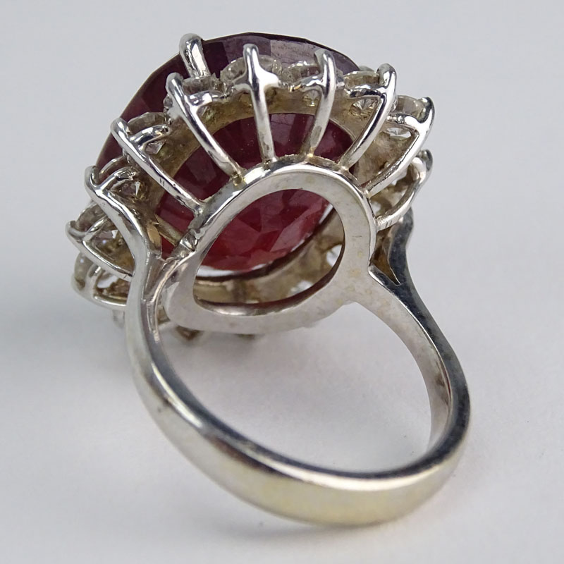 Vintage Large Oval Cut Ruby, Round Brilliant Cut Diamond and 18 Karat White Gold Ring. 