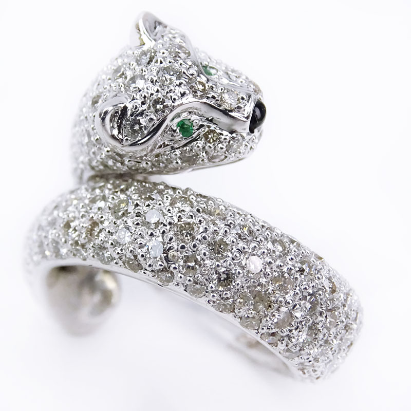 Cartier style Approx. 3.65 Carat Pave Set Round Brilliant Cut Diamond and 18 Karat White Gold Panther Ring with Emerald Eyes.