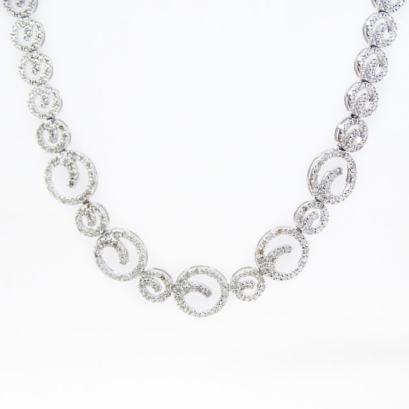 Approx. 1.0 Carat Micro Pave Set Round Brilliant Cut Diamond and 14 Karat White Gold Swirl Design Necklace.