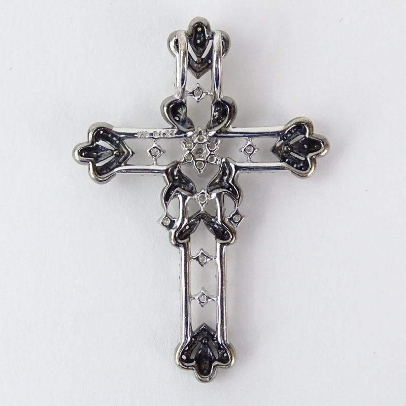 Approx. 1.28 Carat Round Brilliant Cut Diamond and 18 Karat White Gold Cross Pendant.