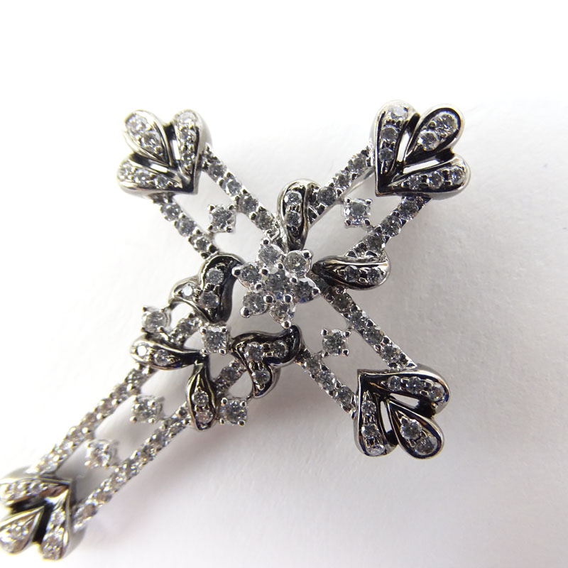 Approx. 1.28 Carat Round Brilliant Cut Diamond and 18 Karat White Gold Cross Pendant.