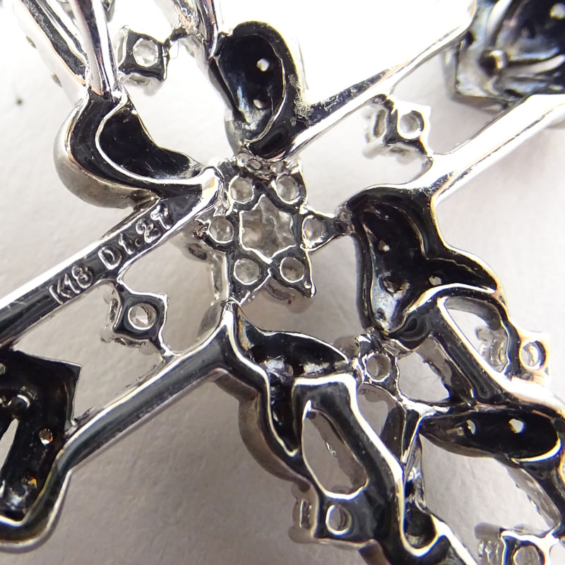 Approx. 1.28 Carat Round Brilliant Cut Diamond and 18 Karat White Gold Cross Pendant.