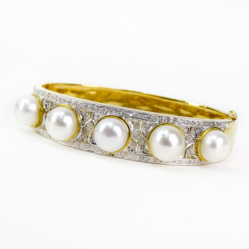 Vintage Hong Kong Pave Set Diamond, Five Pearl and 14 Karat Yellow Gold Hinged Cuff Bangle Bracelet. 