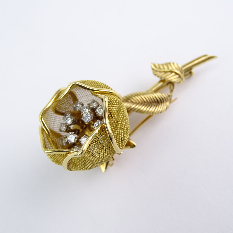 Retro Merrin France Approx. 1.25 Carat Round Brilliant Cut Diamond and 18 Karat Yellow Gold Articulated Flower Brooch.