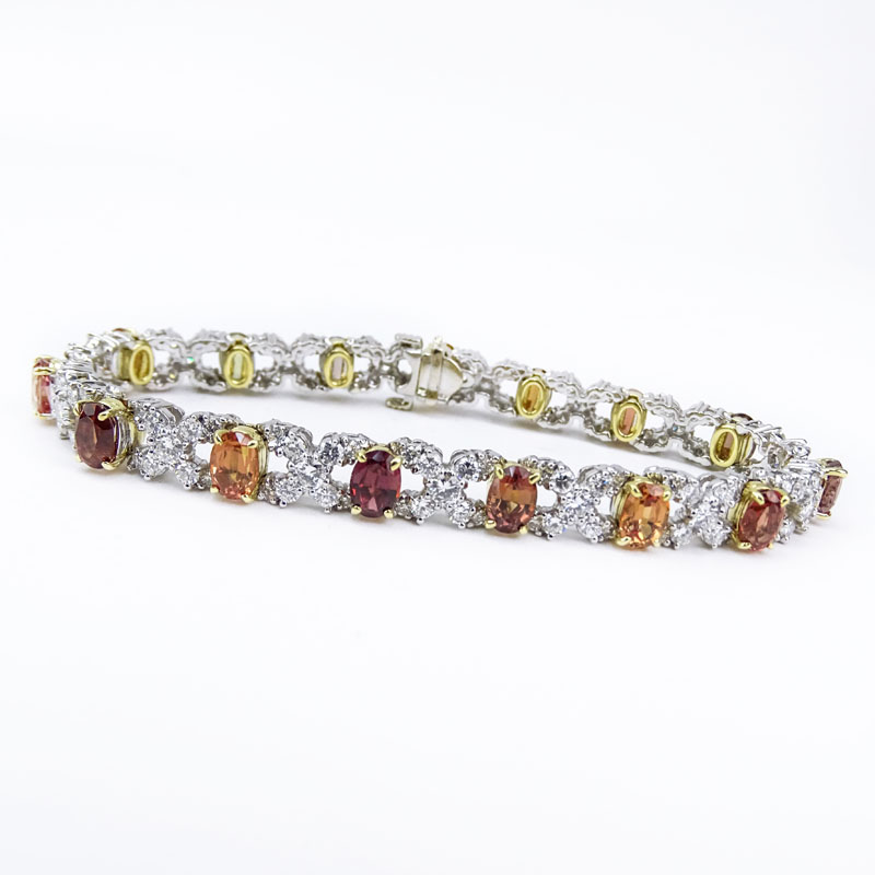 Approx. 6.0 Carat Round Brilliant Cut Diamond, 12.0 Carat Oval Cut Multi-color Sapphire and Platinum XO Bracelet. 