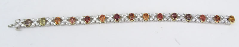 Approx. 6.0 Carat Round Brilliant Cut Diamond, 12.0 Carat Oval Cut Multi-color Sapphire and Platinum XO Bracelet. 