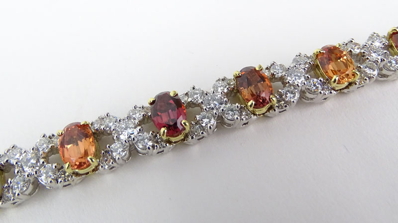 Approx. 6.0 Carat Round Brilliant Cut Diamond, 12.0 Carat Oval Cut Multi-color Sapphire and Platinum XO Bracelet. 