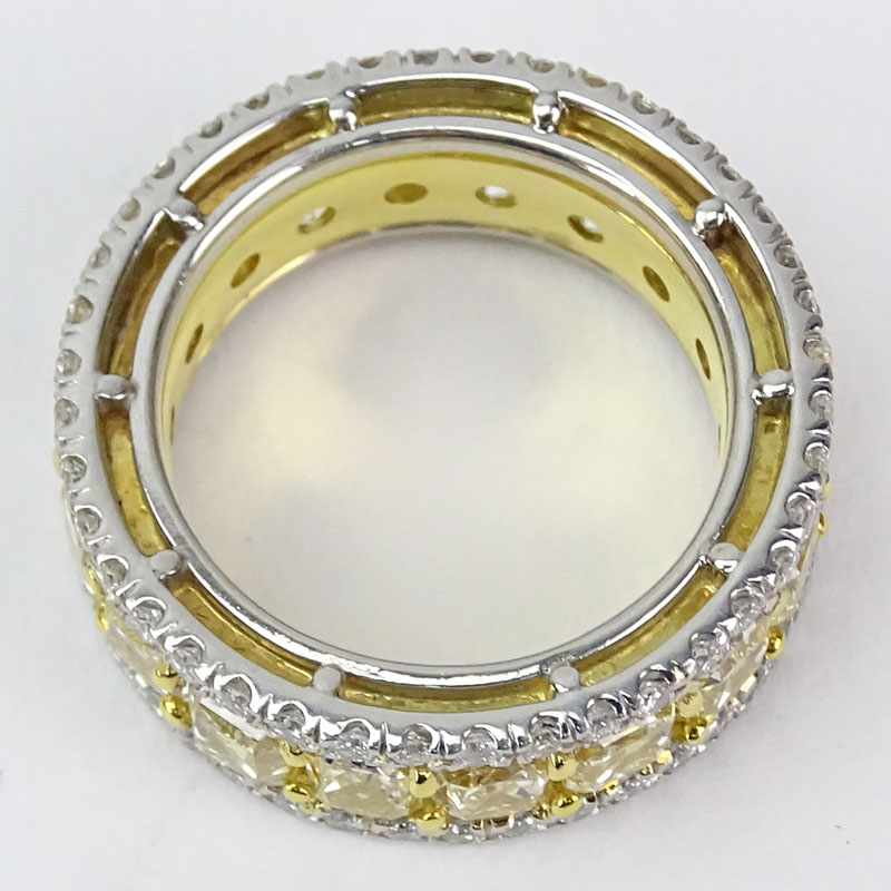 EGL Certified 11.17 Carat Rectangular Cut Fancy Light Yellow-Fancy Yellow Diamond, 1.65 Carat Round Brilliant Cut Diamond, Platinum and 18 Karat Yellow Gold Eternity Band. 