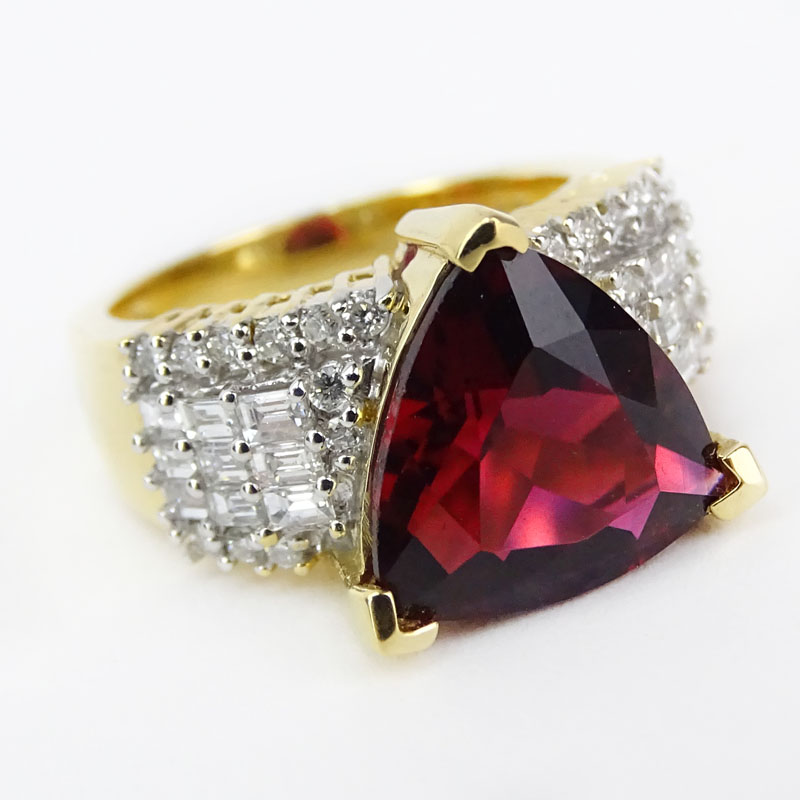 Vintage Rubelite Tourmaline, Baguette and Round Cut Diamond and 18 Karat Yellow Gold Ring. 