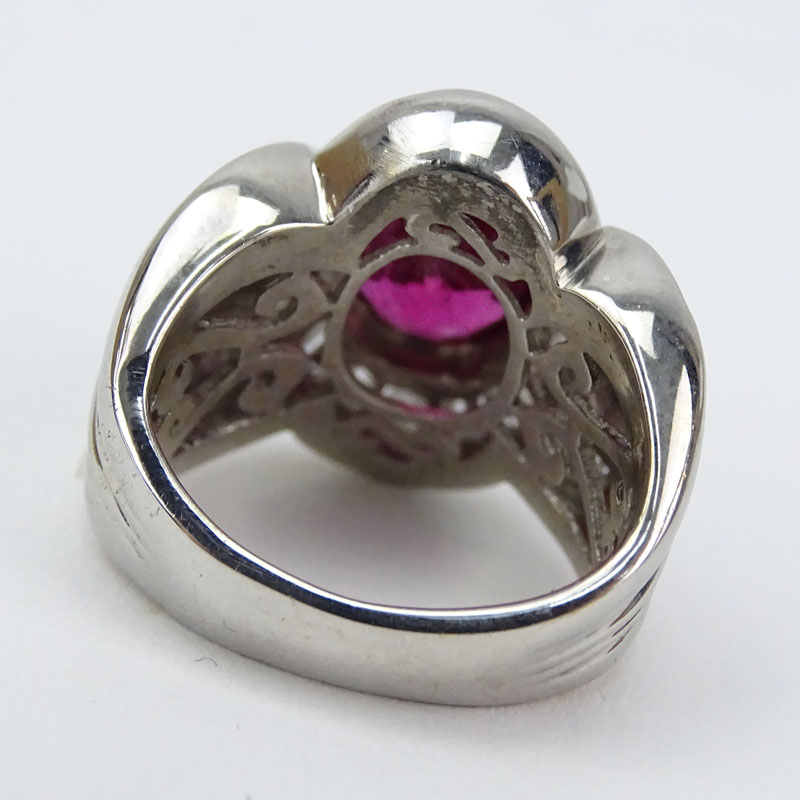 Approx. 8.0 Carat Oval Cut Nigerian Rubelite, 2.0 Carat Baguette Cut Diamond and 18 Karat White Gold Ring. 