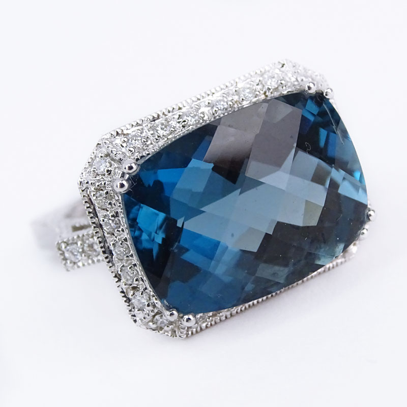 Vintage Oval Criss Cross Cut London Topaz, Diamond and 14 Karat White Gold Ring. 