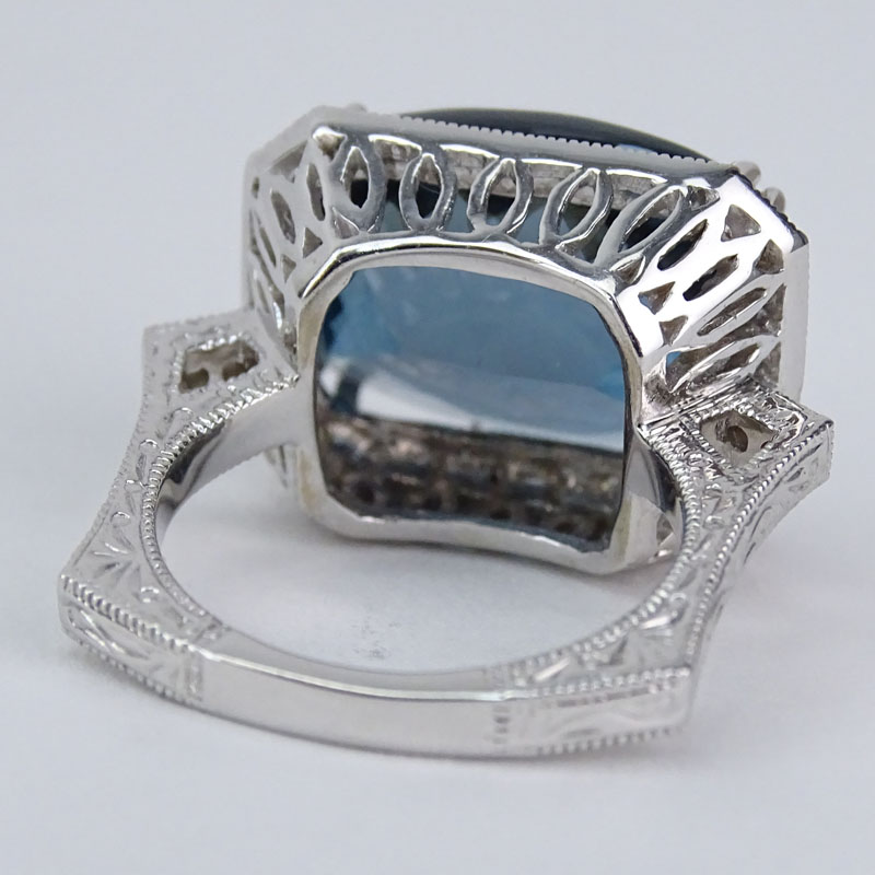 Vintage Oval Criss Cross Cut London Topaz, Diamond and 14 Karat White Gold Ring. 