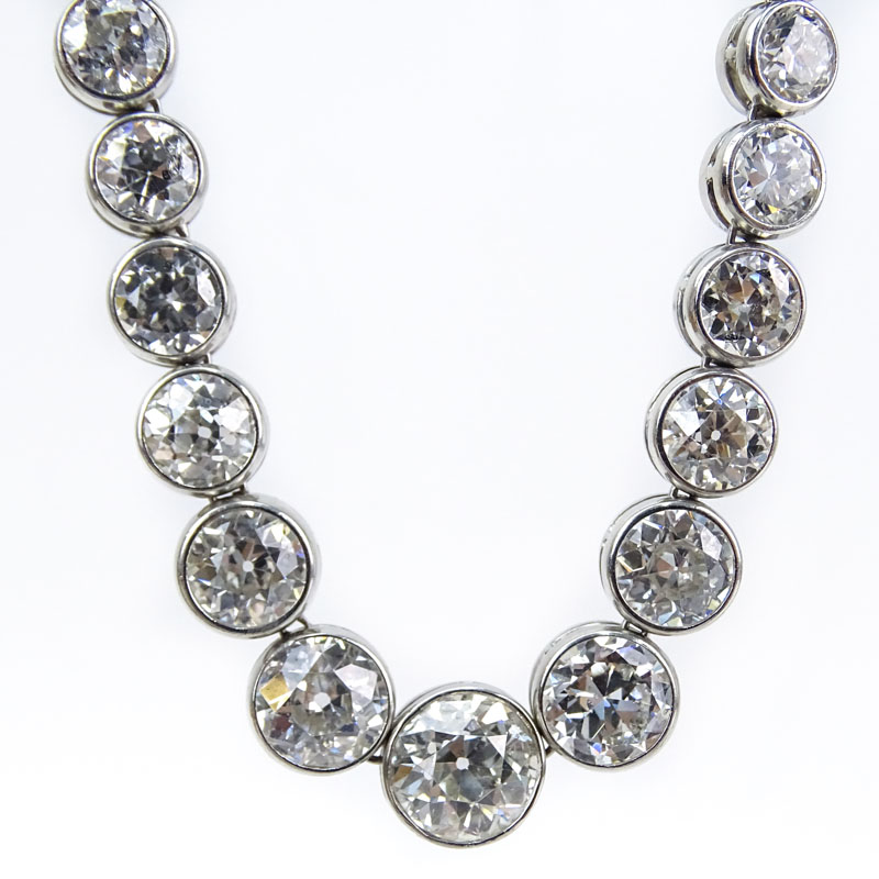 Vintage Approx. 41.0 Carat Bezel Set Graduated Round Brilliant Cut Diamond and Platinum Riviera Necklace, Diamonds F-H color, VS1-SI1 clarity.